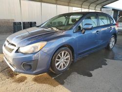 Salvage cars for sale from Copart Fresno, CA: 2013 Subaru Impreza Premium