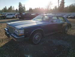 Salvage cars for sale at Graham, WA auction: 1984 Cadillac Seville