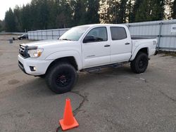 Salvage cars for sale from Copart Arlington, WA: 2013 Toyota Tacoma Double Cab