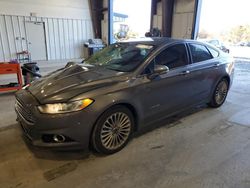 Salvage cars for sale at Byron, GA auction: 2014 Ford Fusion Titanium HEV