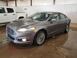 Salvage cars for sale at Lansing, MI auction: 2014 Ford Fusion Titanium