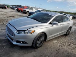 Salvage cars for sale at West Palm Beach, FL auction: 2014 Ford Fusion Titanium HEV