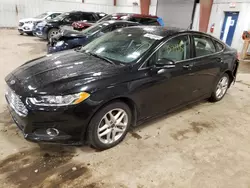 Salvage cars for sale at Lansing, MI auction: 2014 Ford Fusion SE