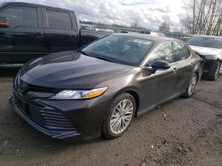 Salvage cars for sale from Copart Arlington, WA: 2020 Toyota Camry XLE