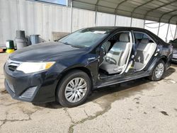 Salvage cars for sale from Copart Fresno, CA: 2012 Toyota Camry Hybrid
