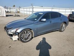 Salvage cars for sale from Copart Bakersfield, CA: 2018 Infiniti Q50 Luxe