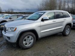 Salvage cars for sale from Copart Arlington, WA: 2011 Jeep Grand Cherokee Laredo