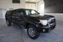 Salvage trucks for sale at Farr West, UT auction: 2013 Toyota Tacoma Double Cab Long BED