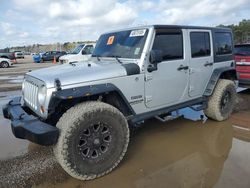 Salvage cars for sale at Greenwell Springs, LA auction: 2012 Jeep Wrangler Unlimited Sport