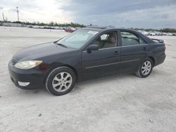 Flood-damaged cars for sale at auction: 2006 Toyota Camry LE