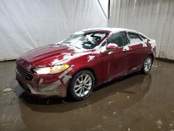 Salvage cars for sale from Copart Central Square, NY: 2019 Ford Fusion SE