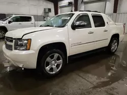 Salvage trucks for sale at Avon, MN auction: 2011 Chevrolet Avalanche LTZ