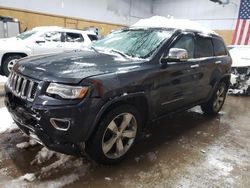 Salvage cars for sale at Kincheloe, MI auction: 2014 Jeep Grand Cherokee Overland