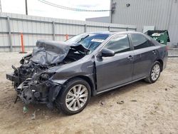 Salvage cars for sale at Jacksonville, FL auction: 2012 Toyota Camry Hybrid