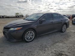 Salvage cars for sale from Copart Haslet, TX: 2018 Toyota Camry Hybrid