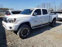 Salvage cars for sale from Copart Arlington, WA: 2014 Toyota Tacoma Double Cab Long BED