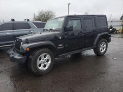 Salvage cars for sale at Woodburn, OR auction: 2014 Jeep Wrangler Unlimited Sahara