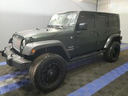 Salvage cars for sale from Copart Orlando, FL: 2010 Jeep Wrangler Unlimited Sport