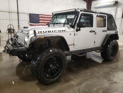 Salvage cars for sale from Copart Avon, MN: 2012 Jeep Wrangler Unlimited Sport