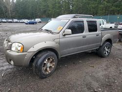Salvage cars for sale from Copart Graham, WA: 2003 Nissan Frontier Crew Cab XE