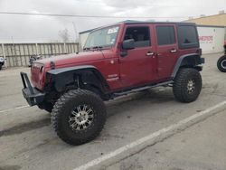 Salvage cars for sale from Copart Anthony, TX: 2012 Jeep Wrangler Unlimited Sport