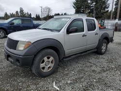 Salvage cars for sale from Copart Graham, WA: 2005 Nissan Frontier Crew Cab LE