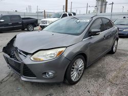 Salvage cars for sale from Copart Wilmington, CA: 2012 Ford Focus SEL