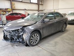 Salvage cars for sale from Copart Nisku, AB: 2015 Toyota Camry Hybrid