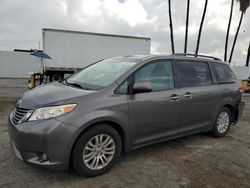 Salvage cars for sale at Van Nuys, CA auction: 2014 Toyota Sienna XLE