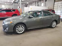 Salvage cars for sale from Copart Blaine, MN: 2012 Toyota Camry Hybrid