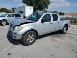 Salvage cars for sale from Copart Orlando, FL: 2010 Nissan Frontier Crew Cab SE
