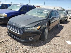 Salvage cars for sale at auction: 2014 Ford Fusion Titanium HEV