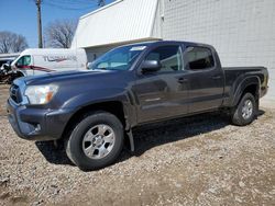 Salvage cars for sale from Copart Blaine, MN: 2015 Toyota Tacoma Double Cab Long BED