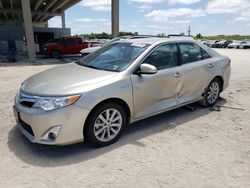 Salvage cars for sale from Copart West Palm Beach, FL: 2014 Toyota Camry Hybrid