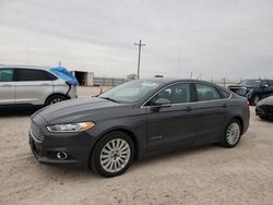 Salvage cars for sale at Andrews, TX auction: 2014 Ford Fusion SE Hybrid