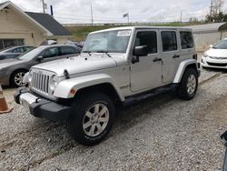 Salvage cars for sale at Northfield, OH auction: 2012 Jeep Wrangler Unlimited Sahara