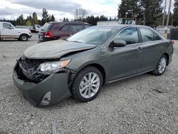 Salvage cars for sale from Copart Graham, WA: 2012 Toyota Camry Hybrid
