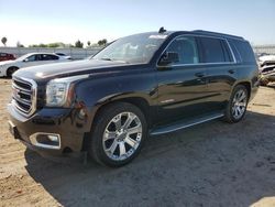 Salvage cars for sale at auction: 2016 GMC Yukon SLE