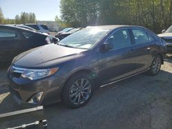 Salvage cars for sale from Copart Arlington, WA: 2014 Toyota Camry Hybrid