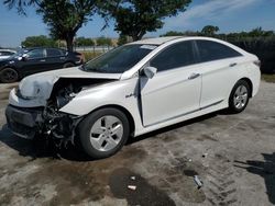 Salvage cars for sale from Copart Orlando, FL: 2012 Hyundai Sonata Hybrid