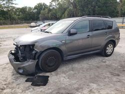Salvage cars for sale from Copart Fort Pierce, FL: 2011 Mitsubishi Outlander ES