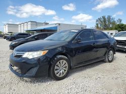 Salvage cars for sale at Opa Locka, FL auction: 2014 Toyota Camry Hybrid