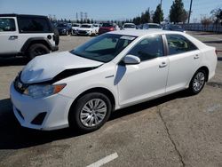 Salvage cars for sale from Copart Rancho Cucamonga, CA: 2012 Toyota Camry Hybrid