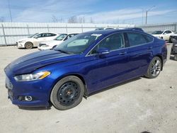 Salvage cars for sale at Nisku, AB auction: 2013 Ford Fusion Titanium