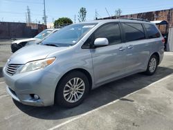 Salvage cars for sale from Copart Wilmington, CA: 2014 Toyota Sienna XLE