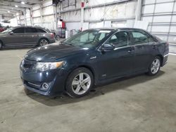 Salvage cars for sale from Copart Woodburn, OR: 2014 Toyota Camry Hybrid
