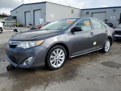 Flood-damaged cars for sale at auction: 2013 Toyota Camry Hybrid