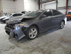 Salvage cars for sale at Jacksonville, FL auction: 2014 Toyota Camry Hybrid