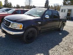 Salvage cars for sale from Copart Graham, WA: 2002 Ford F150 Supercrew