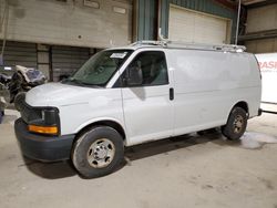 Salvage trucks for sale at Eldridge, IA auction: 2014 Chevrolet Express G2500
